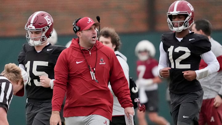 Mar 5, 2025; Tuscaloosa, AL, USA; Quarterbacks coach Nick Seridan walks between quarterbacks Ty Simpson (15) and Keelon Russell (12)during Spring Practice for the Crimson Tide.