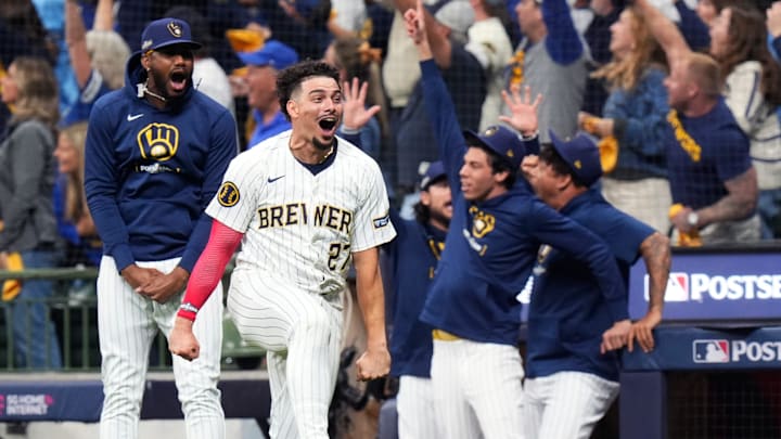 Milwaukee Brewers shortstop Willy Adames (27) reacts to Milwaukee Brewers right fielder Sal Frelick’s (10) homer (1) on a fly ball to right field during the seventh inning of Game 3 of National League wild-card series against the New York Mets on Thursday October 3, 2024 at American Family Field in Milwaukee, Wis.