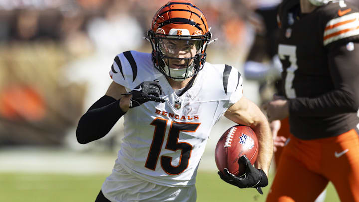 Oct 20, 2024; Cleveland, Ohio, USA; Cincinnati Bengals wide receiver Charlie Jones (15) returns the opening kickoff for a touchdown against the Cleveland Browns during the first quarter at Huntington Bank Field. Mandatory Credit: Scott Galvin-Imagn Images