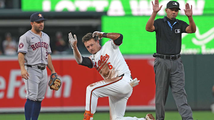 Aug 22, 2024; Baltimore, Maryland, USA; Baltimore Orioles first baseman Ryan Mountcastle (6) reacts during a second-inning double against the Houston Astros at Oriole Park at Camden Yards.