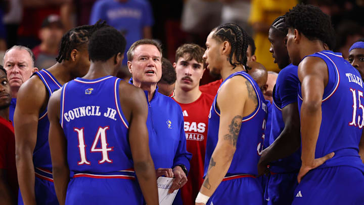 Mar 3, 2026; Tempe, Arizona, USA; Kansas Jayhawks head coach Bill Self (center) in the huddle with his players against the Arizona State Sun Devils in the first half at Desert Financial Arena. Mandatory Credit: Mark J. Rebilas-Imagn Images
