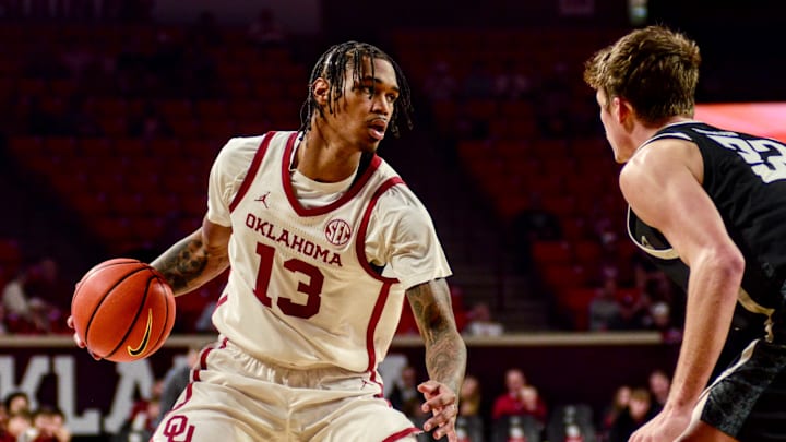 Oklahoma forward Tae Davis dribbles against Stetson.