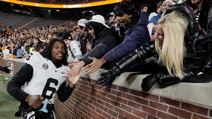 Vanderbilt cornerback Jordan Matthews (6) celebrates with fans the team’s win against Tennessee at Neyland Stadium in Knoxville, Tenn., Saturday, Nov. 29, 2025.
