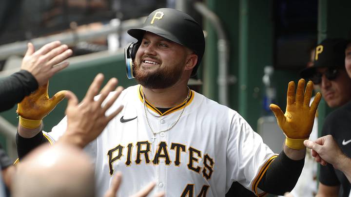 Jul 24, 2024; Pittsburgh, Pennsylvania, USA;  Pittsburgh Pirates first baseman Rowdy Tellez (44) celebrates in the dugout after hitting a solo home run against the St. Louis Cardinals during the fourth inning at PNC Park. Mandatory Credit: Charles LeClaire-Imagn Images