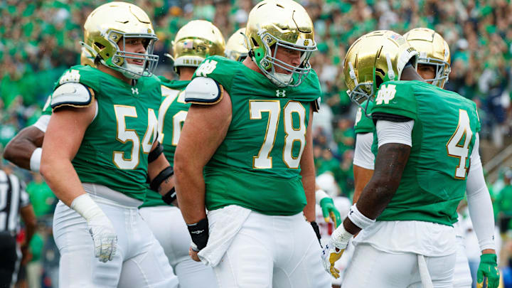 Notre Dame running back Jeremiyah Love (4) and offensive lineman Pat Coogan (78) celebrate a touchdown scored by Love during a NCAA college football game between Notre Dame and Louisville at Notre Dame Stadium on Saturday, Sept. 28, 2024, in South Bend.