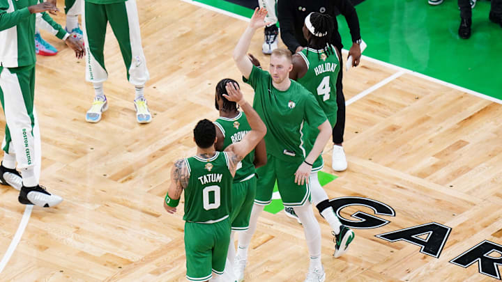 Jun 17, 2024; Boston, Massachusetts, USA; Boston Celtics forward Sam Hauser (30) reacts with guard Jaylen Brown (7) and forward Jayson Tatum (0) in the third quarter against the Dallas Mavericks during game five of the 2024 NBA Finals at TD Garden. Mandatory Credit: David Butler II-Imagn Images