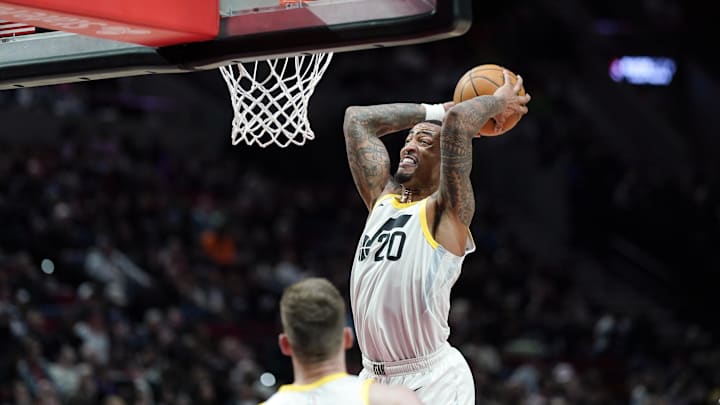 Dec 6, 2024; Portland, Oregon, USA; Utah Jazz power forward John Collins (20) goes up for a dunk against the Portland Trail Blazers during the second half at Moda Center. Mandatory Credit: Soobum Im-Imagn Images