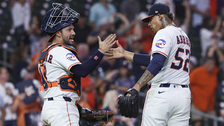 Bryan Abreu and Cesar Salazar congratulate one another. 