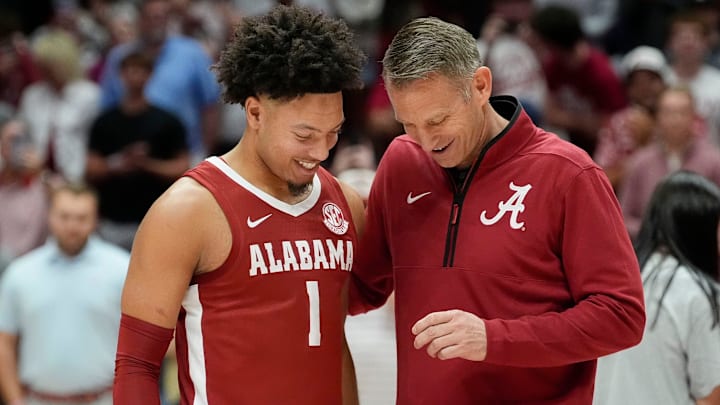 The University of Alabama unveiled the first banner honoring the school’s first Final Four appearance Friday, Oct. 11, 2024, in Coleman Coliseum. Alabama head coach Nate Oats presents a Final Four ring to Alabama guard Mark Sears (1).