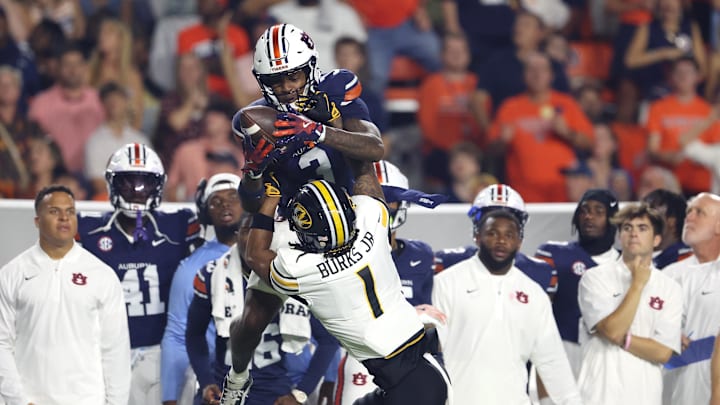Oct 18, 2025; Auburn, Alabama, USA;  Auburn Tigers wide receiver Perry Thompson (3) makes a catch over Missouri Tigers safety Marvin Burks (1) during the first quarter at Jordan-Hare Stadium. Mandatory Credit: John Reed-Imagn Images