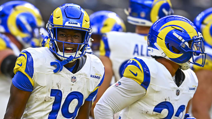 Aug 16, 2025; Inglewood, California, USA; Los Angeles Rams wide receiver Konata Mumpfield (15) celebrates a touchdown with running back Blake Corum (22), against the Los Angeles Chargers during the first quarter at SoFi Stadium. Mandatory Credit: Jonathan Hui-Imagn Images