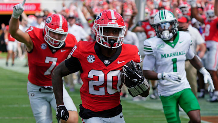 Georgia running back Dwight Phillips Jr (20) drives in for a touchdown during the first half of a NCAA college football game against Marshall in Athens, Ga., on Saturday, August. 30, 2025.