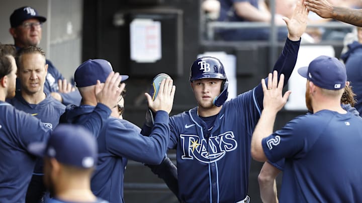 Apr 27, 2024; Chicago, Illinois, USA; Tampa Bay Rays second baseman Curtis Mead (25) celebrates with teammates after scoring against the Chicago White Sox during the second inning at Guaranteed Rate Field. Mandatory Credit: Kamil Krzaczynski-Imagn Images