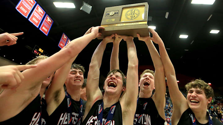The Hesston Swathers celebrate their championship win over Royal Valley in 2022.