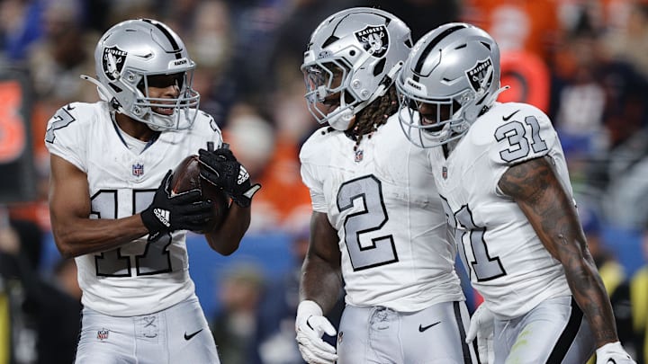 Las Vegas Raiders WR Tyler Lockett reacts with RBs Ashton Jeanty and Raheem Mostert against Denver. Las Vegas Raiders WR Tyler Lockett reacts with RBs Ashton Jeanty and Raheem Mostert against Denver.