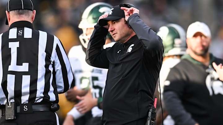 Nov 22, 2025; Iowa City, Iowa, USA; Michigan State Spartans head coach Jonathan Smith talks with an official during the second quarter against the Michigan State Spartans at Kinnick Stadium. Mandatory Credit: Jeffrey Becker-Imagn Images
