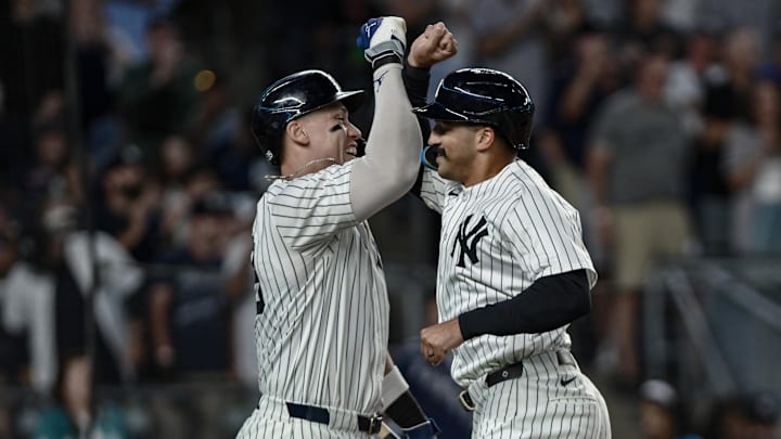 Aug 24, 2025; Bronx, New York, USA; New York Yankees outfielder Trent Grisham (12) celebrates with outfielder Aaron Judge (99) after hitting a solo home run against the Boston Red Sox during the third inning at Yankee Stadium. Mandatory Credit: John Jones-Imagn Images