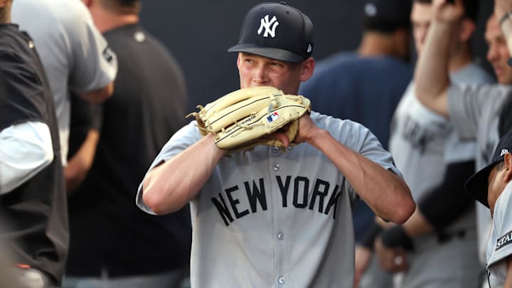 Apr 17, 2025; St. Petersburg, Florida, USA; New York Yankees starting pitcher Will Warren (98) reacts in the dugout as he left the game during the second inning against the Tampa Bay Rays at George M. Steinbrenner Field. 
