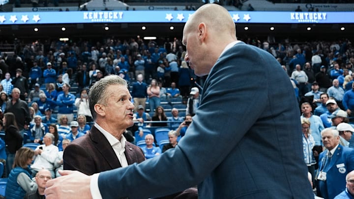 Former UK coach and current Arkansas head coach John Calipari shakes the hand of Kentucky coach Mark Pope after the Hogs beat the Cats in Calipari's return Saturday Feb. 1, 2025 at Rupp Arena in Lexington, Kentucky.