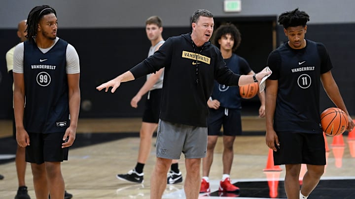 Vanderbilt head coach Mark Byington instructs forward Devin McGlockton (99) and guard A.J. Hoggard (11) during an NCAA college basketball practice Tuesday, October 8, 2024, in Nashville, Tenn.
