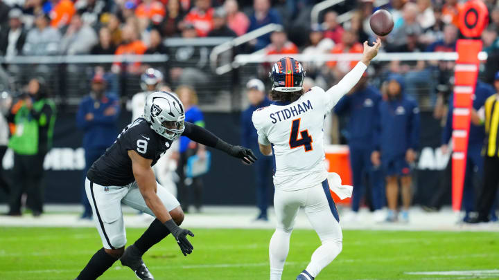 Jan 7, 2024; Paradise, Nevada, USA; Las Vegas Raiders defensive end Tyree Wilson (9) pressures Denver Broncos quarterback Jarrett Stidham (4) during the first quarter at Allegiant Stadium. Mandatory Credit: Stephen R. Sylvanie-USA TODAY Sports