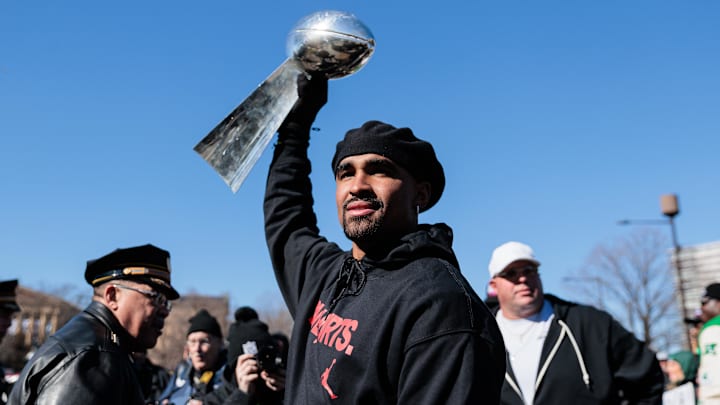 Feb 14, 2025; Philadelphia, PA, USA; Philadelphia Eagles quarterback Jalen Hurts (1) raises the Lombardi Trophy during the Super Bowl LIX championship parade and rally. Mandatory Credit: Caean Couto-Imagn Images Feb 14, 2025; Philadelphia, PA, USA; Philadelphia Eagles quarterback Jalen Hurts (1) raises the Lombardi Trophy during the Super Bowl LIX championship parade and rally. Mandatory Credit: Caean Couto-Imagn Images
