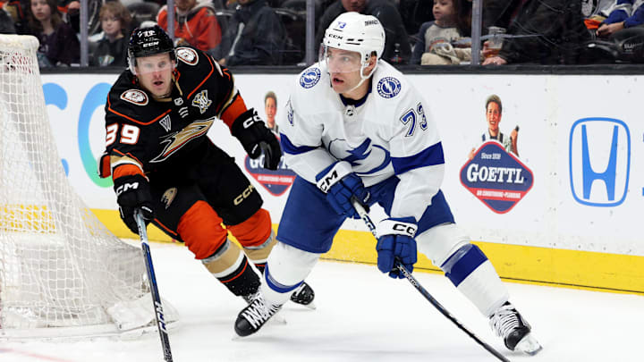 Mar 24, 2024; Anaheim, California, USA; Tampa Bay Lightning left wing Conor Sheary (73) passes from Anaheim Ducks center Ben Meyers (39) during the first period at Honda Center. Mandatory Credit: Jason Parkhurst-Imagn Images