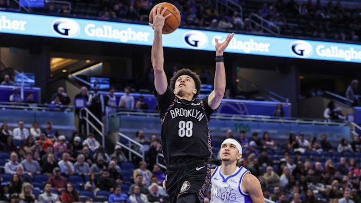 Feb 5, 2026; Orlando, Florida, USA; Brooklyn Nets guard Nolan Traore (88) shoots against Orlando Magic guard Anthony Black (0) during the first quarter at Kia Center. Mandatory Credit: Mike Watters-Imagn Images