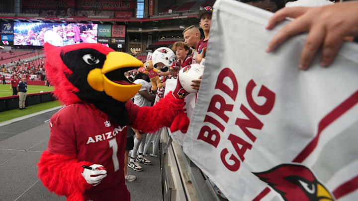 Arizona Cardinals mascot Big Red signs autographs for fans after the team's training camp practice at State Farm Stadium in Glendale, Ariz., on Saturday, Aug. 3, 2024. Arizona Cardinals mascot Big Red signs autographs for fans after the team's training camp practice at State Farm Stadium in Glendale, Ariz., on Saturday, Aug. 3, 2024.