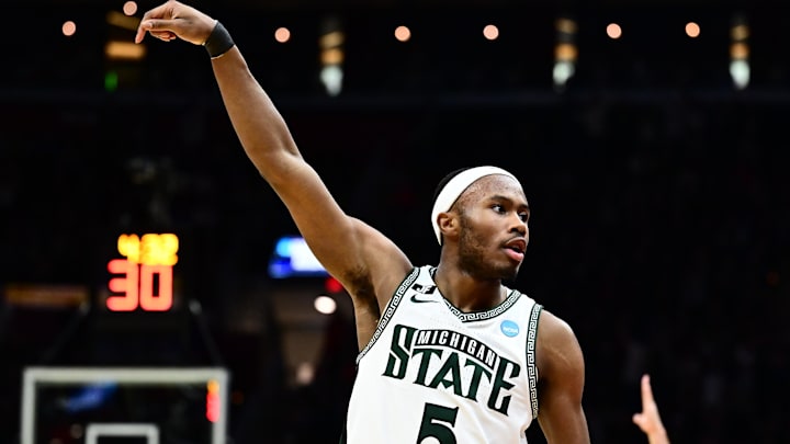 Mar 23, 2025; Cleveland, OH, USA; Michigan State Spartans guard Tre Holloman (5) reacts in the second half against the New Mexico Lobos during the NCAA Tournament Second Round at Rocket Arena. Mandatory Credit: Ken Blaze-Imagn Images