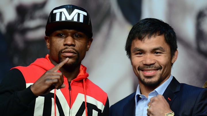 Apr 29, 2015; Las Vegas, NV, USA; Floyd Mayweather and Manny Pacquiao pose for a photo during a press conference at KA Theatre. Mandatory Credit: Joe Camporeale-Imagn Images Apr 29, 2015; Las Vegas, NV, USA; Floyd Mayweather and Manny Pacquiao pose for a photo during a press conference at KA Theatre. Mandatory Credit: Joe Camporeale-Imagn Images