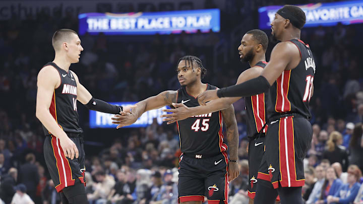 Feb 12, 2025; Oklahoma City, Oklahoma, USA; Miami Heat guard Tyler Herro (14), guard Davion Mitchell (45), forward Andrew Wiggins (22) and center Bam Adebayo (13) high five after a play against the Oklahoma City Thunder during the first quarter at Paycom Center. Mandatory Credit: Alonzo Adams-Imagn Images Feb 12, 2025; Oklahoma City, Oklahoma, USA; Miami Heat guard Tyler Herro (14), guard Davion Mitchell (45), forward Andrew Wiggins (22) and center Bam Adebayo (13) high five after a play against the Oklahoma City Thunder during the first quarter at Paycom Center. Mandatory Credit: Alonzo Adams-Imagn Images