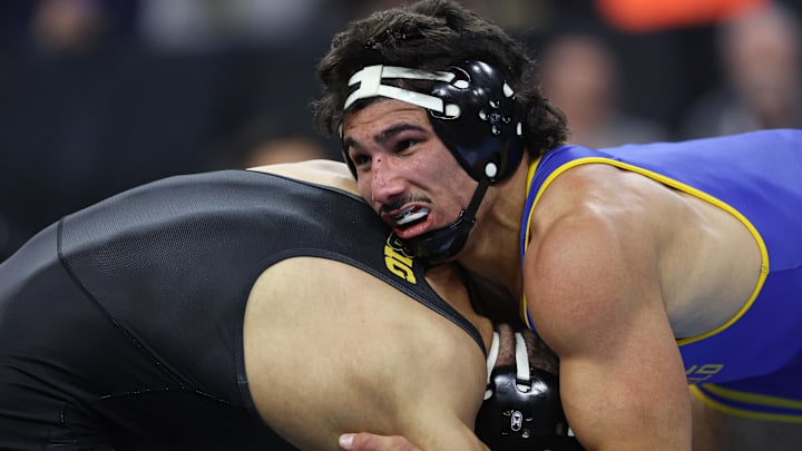 AJ Ferrari of CSU Bakersfield wrestles Stephen Buchanan of Iowa during the semifinals of the NCAA Wrestling Championships at Wells Fargo Center.