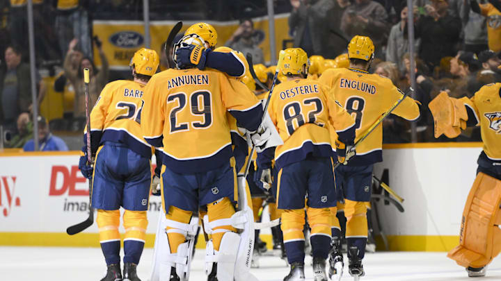 Apr 8, 2025; Nashville, Tennessee, USA;  Nashville Predators center Fedor Svechkiv (40) celebrates his game=winning goal with his teammates  during the over time period at Bridgestone Arena. Mandatory Credit: Steve Roberts-Imagn Images