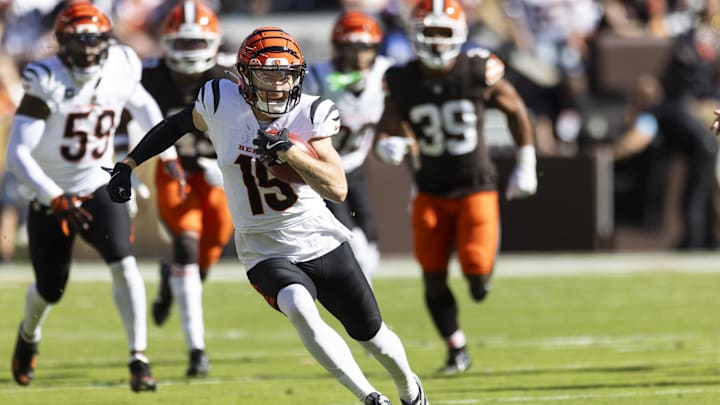 Oct 20, 2024; Cleveland, Ohio, USA; Cincinnati Bengals wide receiver Charlie Jones (15) returns the opening kickoff for a touchdown against the Cleveland Browns during the first quarter at Huntington Bank Field. Mandatory Credit: Scott Galvin-Imagn Images