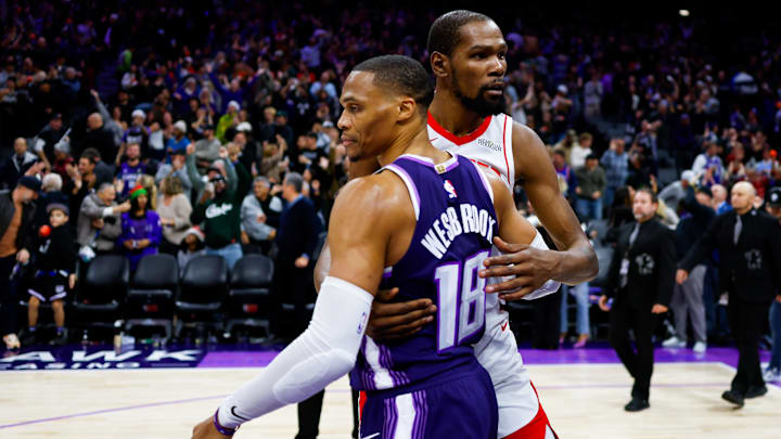 Dec 21, 2025; Sacramento, California, USA; Houston Rockets forward Kevin Durant (7) and Sacramento Kings guard Russell Westbrook (18) hug after the game at Golden 1 Center. Mandatory Credit: Sergio Estrada-Imagn Images