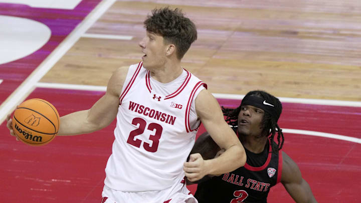 Wisconsin forward Will Garlock (23) makes a move on Ball State guard Davion Hill (2) during the first half of their game Tuesday, November 11, 2025 at the Kohl Center in Madison, Wisconsin.