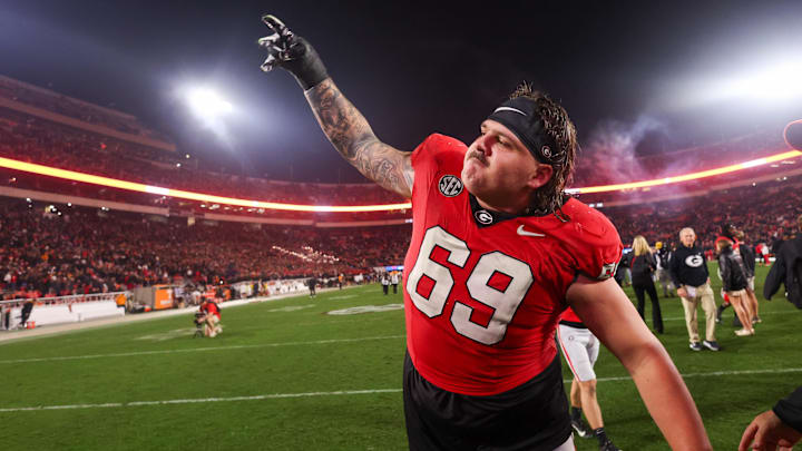 Nov 16, 2024; Athens, Georgia, USA; Georgia Bulldogs offensive lineman Tate Ratledge (69) celebrates after a victory over the Tennessee Volunteers at Sanford Stadium. Mandatory Credit: Brett Davis-Imagn Images
Nov 16, 2024; Athens, Georgia, USA; Georgia Bulldogs offensive lineman Tate Ratledge (69) celebrates after a victory over the Tennessee Volunteers at Sanford Stadium. Mandatory Credit: Brett Davis-Imagn Images