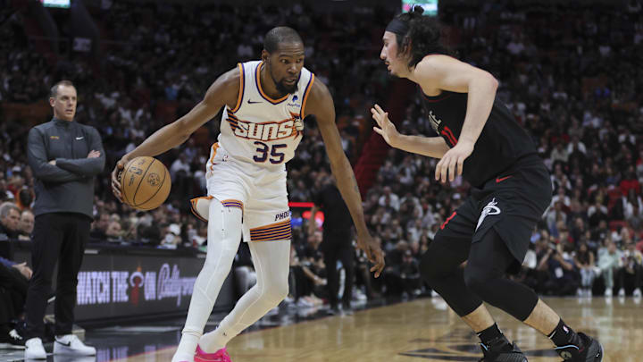 Jan 29, 2024; Miami, Florida, USA; Phoenix Suns forward Kevin Durant (35) moves to the basket against Miami Heat guard Jaime Jaquez Jr. (11) during the second quarter at Kaseya Center. Mandatory Credit: Sam Navarro-Imagn Images