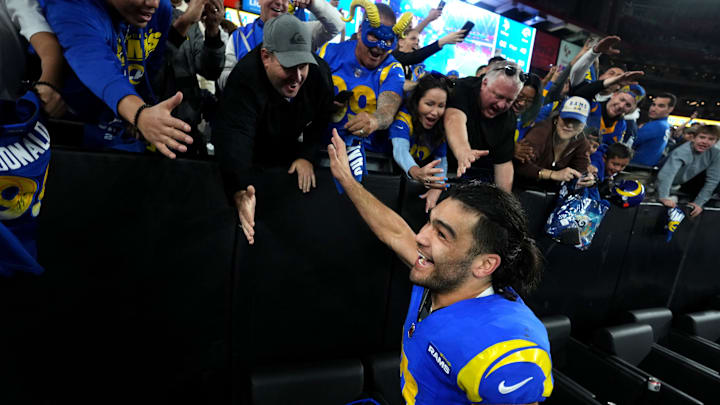 Los Angeles Rams receiver Puka Nacua (17) high-fives fans after their 27-9 playoff win over the Minnesota Vikings at State Farm Stadium on Jan. 13, 2025, in Glendale.
