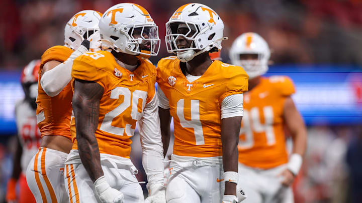 Aug 30, 2025; Atlanta, Georgia, USA; Tennessee Volunteers defensive lineman Jordan Ross (29) celebrates with defensive back Ty Redmond (4) after a tackle against the Syracuse Orange in the third quarter at Mercedes-Benz Stadium. Mandatory Credit: Brett Davis-Imagn Images