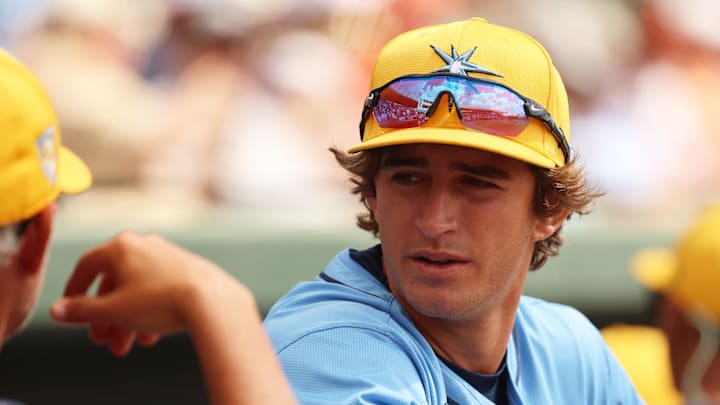 Mar 12, 2024; Sarasota, Florida, USA; Tampa Bay Rays infielder Carson Williams (80) talks with manager Kevin Cash (16) before the game against the Baltimore Orioles at Ed Smith Stadium.