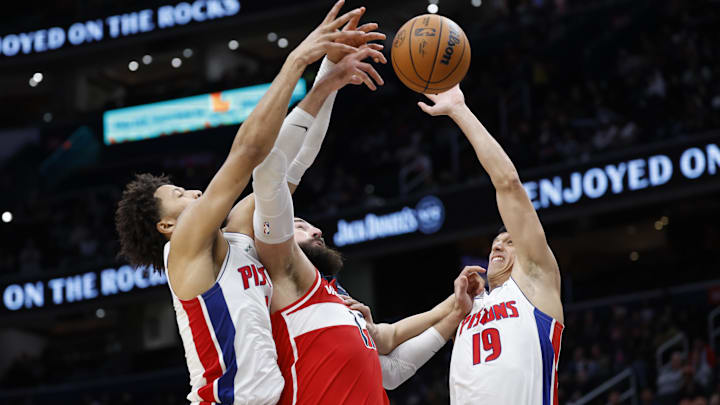 Nov 17, 2024; Washington, District of Columbia, USA; Washington Wizards center Jonas Valanciunas (17) is fouled while shooting the ball by Detroit Pistons guard Cade Cunningham (2) as Pistons forward Simone Fontecchio (19) defends: Geoff Burke-Imagn Images