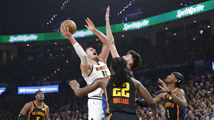 Denver Nuggets center Nikola Jokic (15) shoots against Oklahoma City Thunder forward Chet Holmgren (7) during the second quarter during game one of the second round for the 2025 NBA Playoffs at Paycom Center. Mandatory Credit: Alonzo Adams-Imagn Images Denver Nuggets center Nikola Jokic (15) shoots against Oklahoma City Thunder forward Chet Holmgren (7) during the second quarter during game one of the second round for the 2025 NBA Playoffs at Paycom Center. Mandatory Credit: Alonzo Adams-Imagn Images