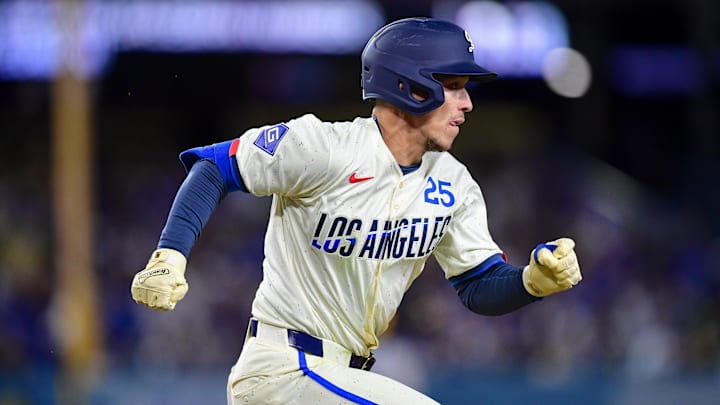 Apr 26, 2025; Los Angeles, California, USA; Los Angeles Dodgers second baseman Tommy Edman (25) runs after hitting a double against the Pittsburgh Pirates during the eighth inning at Dodger Stadium. Mandatory Credit: Gary A. Vasquez-Imagn Images Apr 26, 2025; Los Angeles, California, USA; Los Angeles Dodgers second baseman Tommy Edman (25) runs after hitting a double against the Pittsburgh Pirates during the eighth inning at Dodger Stadium. Mandatory Credit: Gary A. Vasquez-Imagn Images
