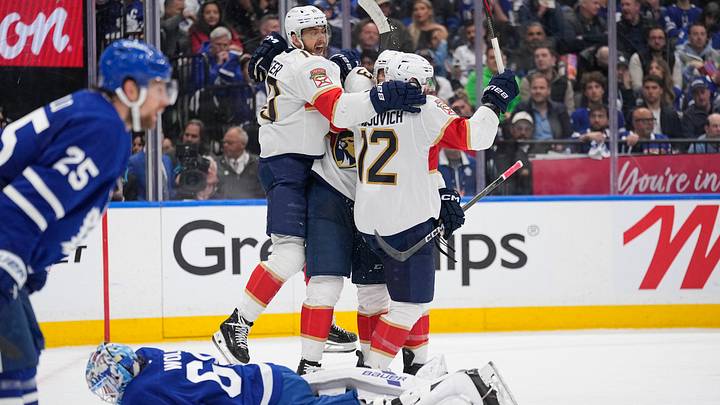 May 18, 2025; Toronto, Ontario, CAN; Florida Panthers forward A.J. Greer (10) celebrates a goal by forward Jonah Gadjovich (12) as Toronto Maple Leafs goaltender Joseph Woll (60) lies on the ice during the second period of game seven of the second round of the 2025 Stanley Cup Playoffs at Scotiabank Arena. Mandatory Credit: John E. Sokolowski-Imagn Images
