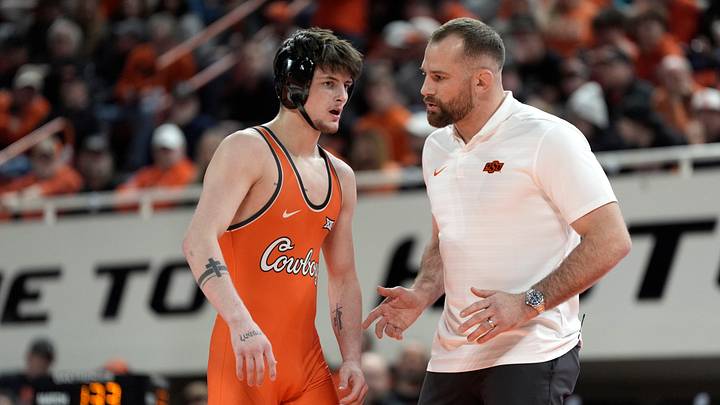 Oklahoma State's Jax Forrest talks with coach David Taylor. Oklahoma State's Jax Forrest talks with coach David Taylor.
