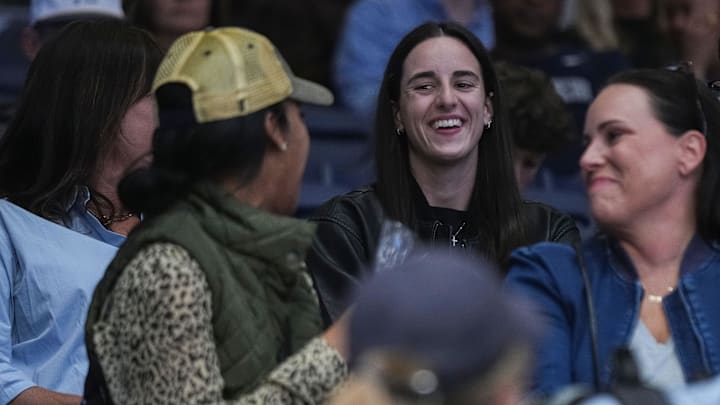 Indiana Fever Caitlin Clark smiles while talking to Butler Bulldogs fans on Monday, Nov. 4, 2024, during the game at Hinkle Fieldhouse in Indianapolis. The Butler Bulldogs defeated the Missouri State Bears, 72-65. Indiana Fever Caitlin Clark smiles while talking to Butler Bulldogs fans on Monday, Nov. 4, 2024, during the game at Hinkle Fieldhouse in Indianapolis. The Butler Bulldogs defeated the Missouri State Bears, 72-65.