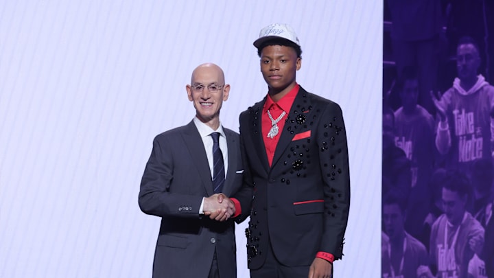 Ace Bailey stands with NBA commissioner Adam Silver after being selected as the fifth pick by the Utah Jazz in the first round of the 2025 NBA Draft at Barclays Center.