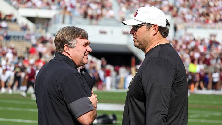 Nov 8, 2025; Starkville, Mississippi, USA; Georgia Bulldogs head coach Kirby Smart and Mississippi State Bulldogs head coach Jeff Lebby talk before the game at Davis Wade Stadium at Scott Field. Nov 8, 2025; Starkville, Mississippi, USA; Georgia Bulldogs head coach Kirby Smart and Mississippi State Bulldogs head coach Jeff Lebby talk before the game at Davis Wade Stadium at Scott Field.